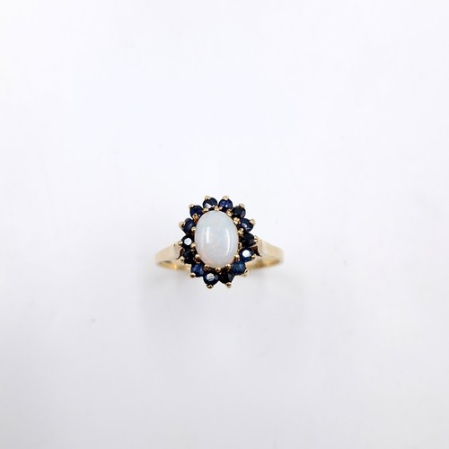 47 - Star Lot : A stunning Opal and Sapphire,  nine carat gold ring. Size - Q. Weight - 2.52 grams.