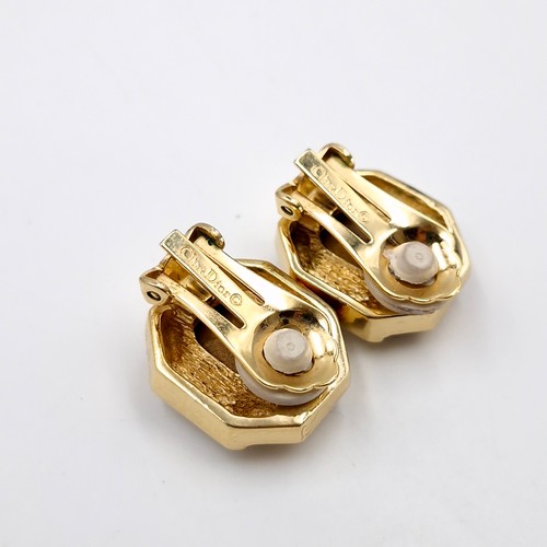 19 - Star Lot : A pair of Christian Dior (marked to clasp) blue stone clasp earrings with gem set detail.... 