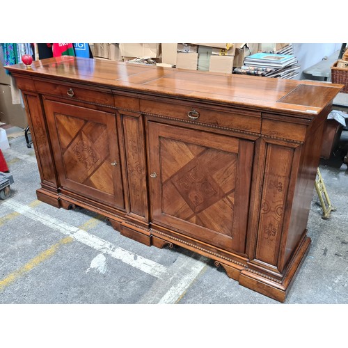 938 - Star Lot : A large oak Italian sideboard featuring exquisite inlaid panels, complemented by two eleg... 