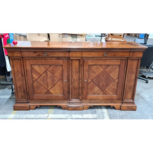 938 - Star Lot : A large oak Italian sideboard featuring exquisite inlaid panels, complemented by two eleg... 