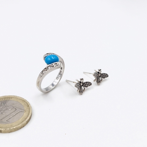 14 - A sterling silver turquoise ring. Size - M. Weight - 3.1 grams. Together with a pair of bee style st... 