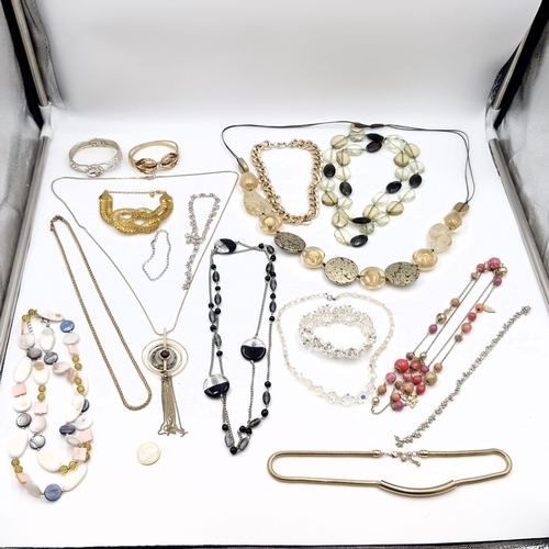 25 - A large collection of assorted costume jewellery. Weight - 720 grams. Items as per photographed.