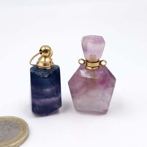 28 - A pretty cut quartz perfume bottle with stopper. Weight - 17.87 grams. Together with a tourmaline pe... 