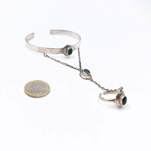 57 - An attractive vintage, Roman style  cuff bracelet set with cabochon stone accents with suspension ch... 