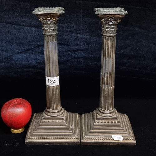 124 - A handsome pair of silverplated Corinthian column candlesticks.