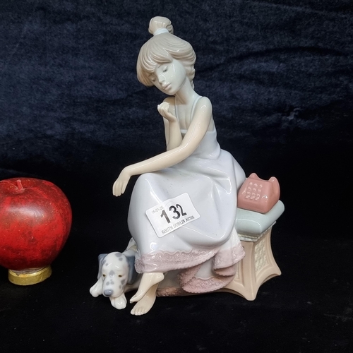 132 - A large Lladro porcelain 'Chit Chat' girl on the phone with Dalmatian dog. In very good condition.