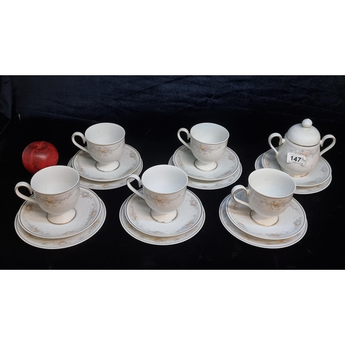 147 - An 18 piece Noritake Ireland porcelain tea set with gilt rim and hand painted elements.