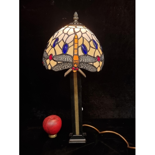 194 - A lovely heavy example of a Tiffany style lamp with a shade featuring dragonfly motifs. Nice piece.