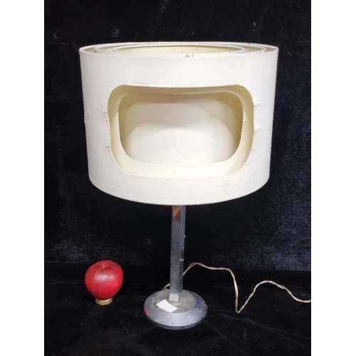 195 - An unusual cream table lamp with unusual shade paired with a chrome base.