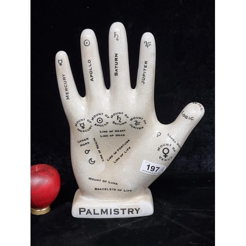 197 - A large ceramic decorative Palmistry hand. In good condition.