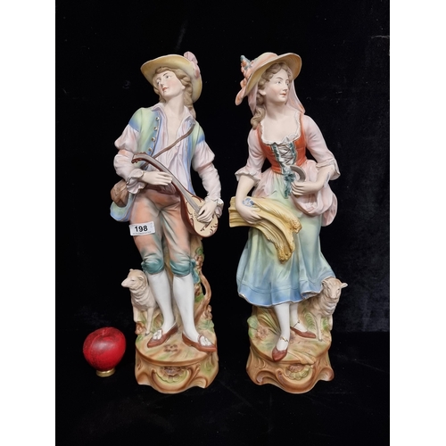 198 - A pair of very large Capodimonte style ceramic figures of a young boy and girl. In very good conditi... 