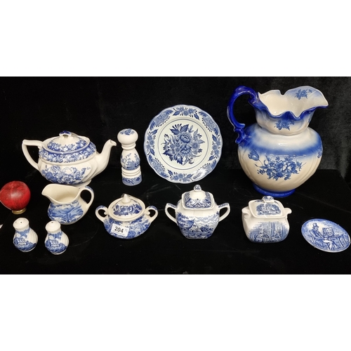 204 - A selection of 11 vintage and antique blue and white porcelain pieces including a very large water j... 