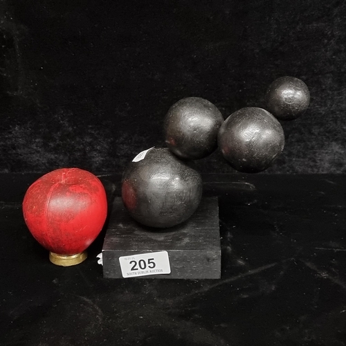 205 - A contemporary modern hand crafted spherical sculpture made of wood in a black painted finish.