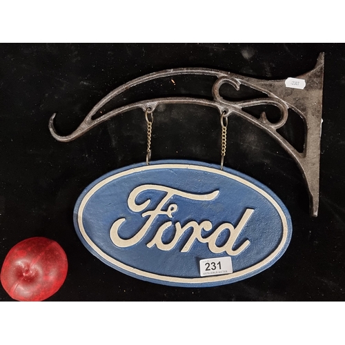 231 - A hand painted heavy cast metal wall mounted bracket and double side sign advertising Ford.