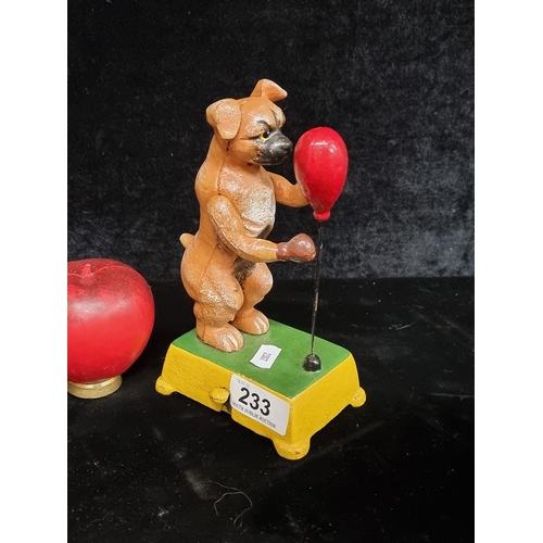 233 - A characterful cast metal money box in the form of a boxing dog.