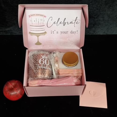 237 - A super fun 60th birthday gift set which includes a candle, makeup bag, bath bomb, travel mug etc.