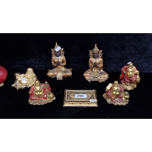 250 - Seven brass toned Indian themed items including six Buddha figurines.