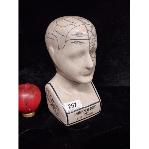 257 - A ceramic Phrenology bust by L.N. Fowler. With detail annotation to skull.