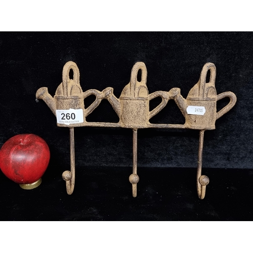 260 - A cast metal wall hook to hang your garden utensils etc.