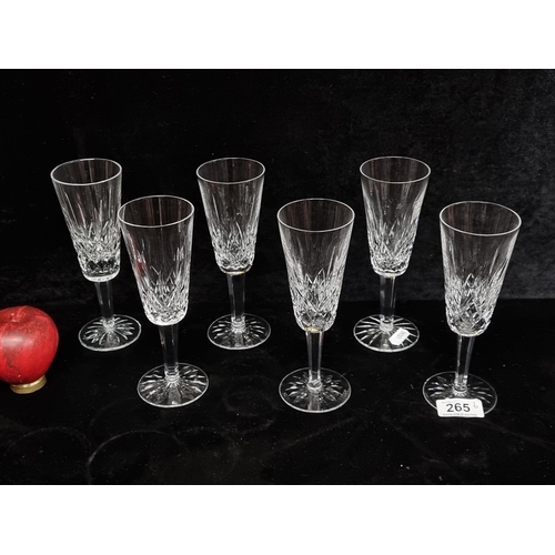 265 - Star lot : A gorgeous set of six Waterford Crystal champagne flutes in the Lismore pattern. All in e... 