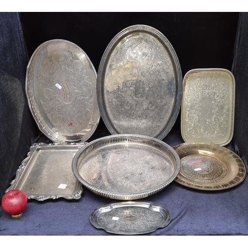 297 - Seven silver plate and brass items including six serving trays, some featuring very pretty pierced g... 