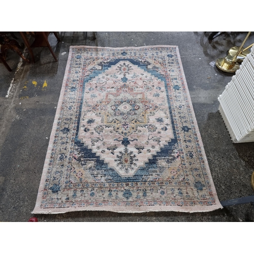 298 - An Easy Living Sample Tabas rug in a blue and gold pattern. MM: 160cm x 225cm.