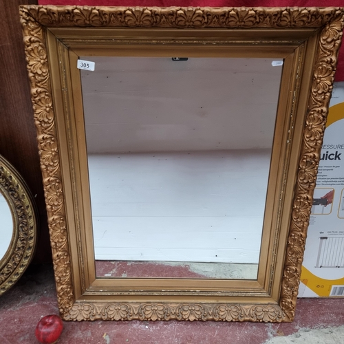 305 - A large wall mirror housed in an antique gilt wood frame. MM: 70cm x 87cm.