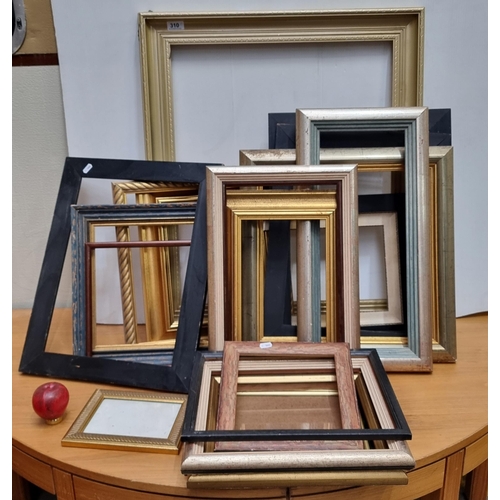 310 - A large selection of modern and vintage frames, can be reused for framing artwork or repurposed. Gre... 