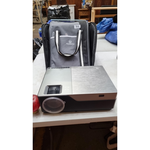 312 - A Vankyo Performance V600 projector. Model: M18. AC100-240v. Complete with cable and protective case... 