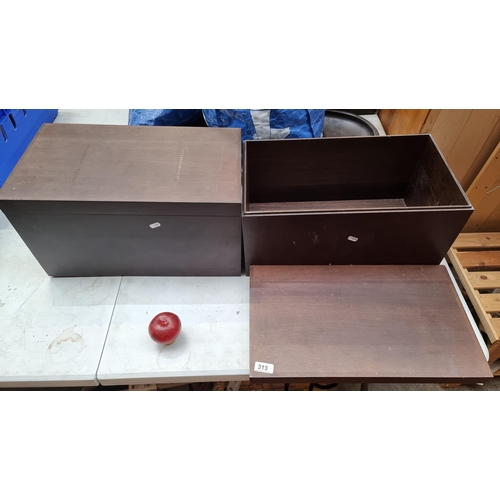 313 - A pair of stained oak wood lidded storage boxes.