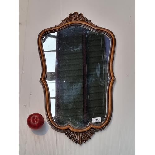 324 - A lovely antique style wall mirror.