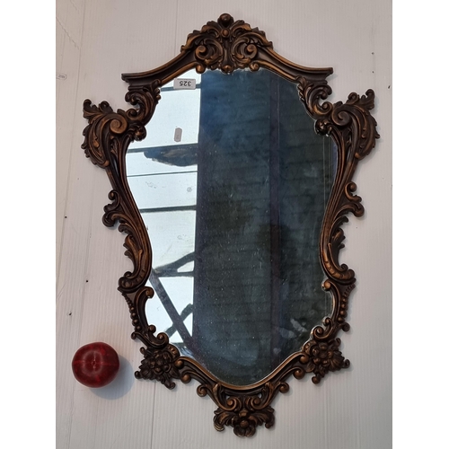 325 - A stunning Rococo style wall mirror.