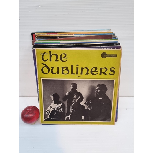 329 - A collection of 35 vinyl records including The Dubliners, Nat King Cole, Kenny G, John Carroll, and ... 