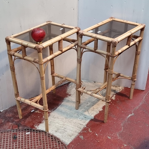 333 - A pair of vintage glass topped cane bamboo side tables.