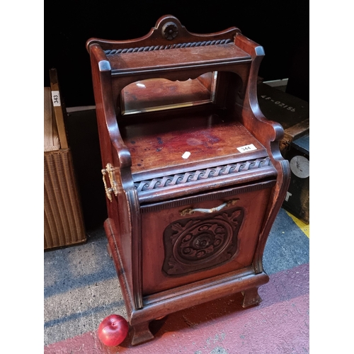 344 - An antique Victorian mahogany Coal purdonium with beveled mirror and carved rose detailing to front.