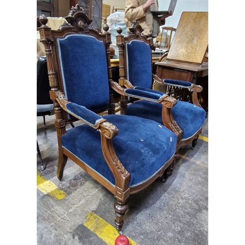 356 - Star Lot : A fine pair of Victorian style armchairs with rich royal blue velvet upholstery and heavi... 