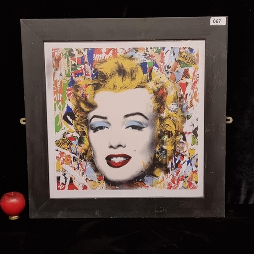 67 - A print after 'Mr. Brainwash' titled 'Marilyn Monroe'. Housed in a black frame behind glass.