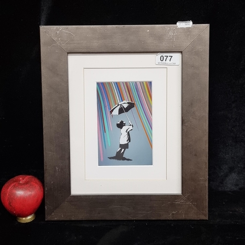 77 - A high quality print after an original piece of graffiti by Banksy titled 'Rainbow Rain Umbrella Boy... 