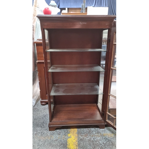 403 - Star Lot : Vintage mahogany display cabinet with beveled glass door, geometric muntins, and three gl... 