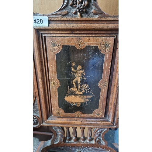 420 - Star lot : A black forest 19th-Century European carved walnut chair with lift-up secret seat, intric... 