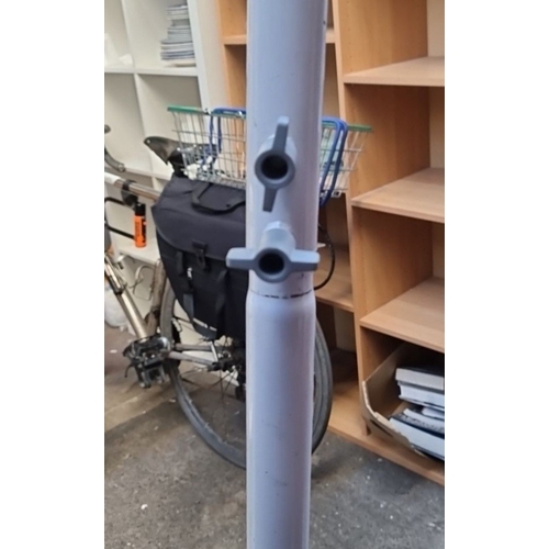 424 - A metal clothes stand. Ideal for clothing photography. Im told it can also be used as a disability s... 