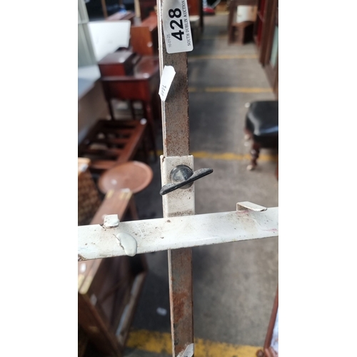 428 - Adjustable vintage artist’s easel in sturdy metal construction, showing wear consistent with age and... 