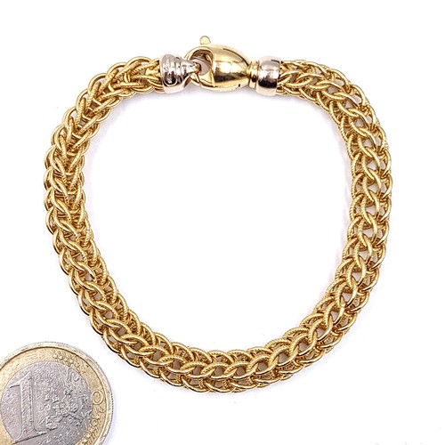 8 - Super Star Lot:
An 18ct gold bracelet with a delicate intertwined band and a heavy gold clasp.

Leng... 