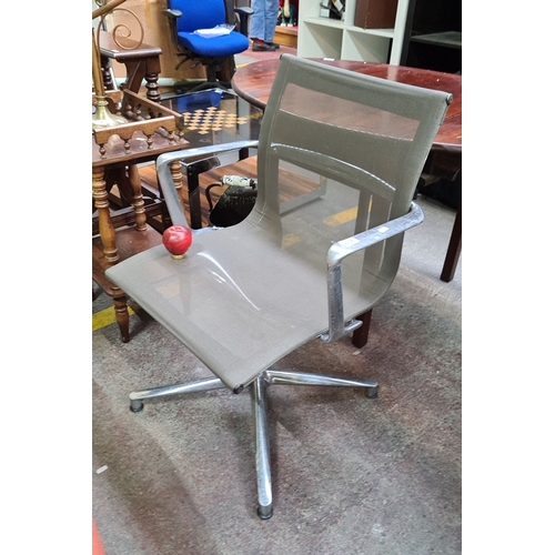 1083 - Star Lot : A Super mesh office swivel Eames chair by ICF with chrome frame, ICF label to the base. I... 