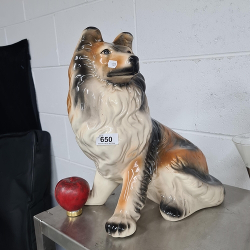 A large and nicely detailed glazed ceramic figure of a boarder collie dog.