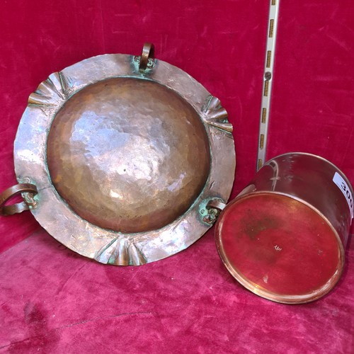 300 - A heavy quality Art Nouveau hammered copper ash tray with a copper tobacco jar.