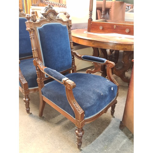 356 - Star Lot : A fine pair of Victorian style armchairs with rich royal blue velvet upholstery and heavi... 