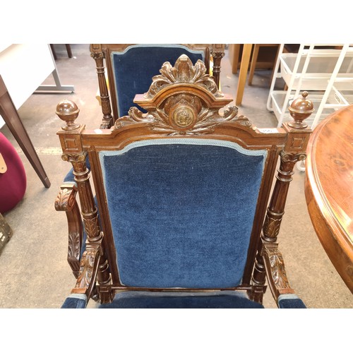 356 - Star Lot : A fine pair of Victorian style armchairs with rich royal blue velvet upholstery and heavi... 