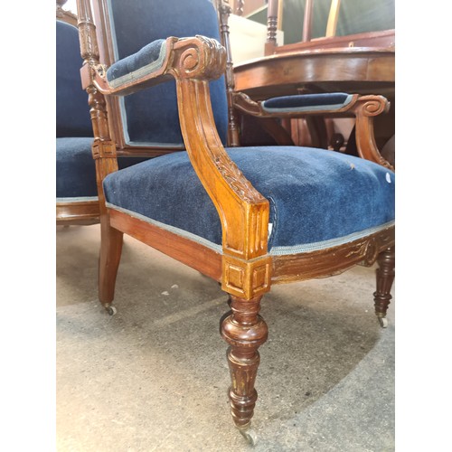 356 - Star Lot : A fine pair of Victorian style armchairs with rich royal blue velvet upholstery and heavi... 