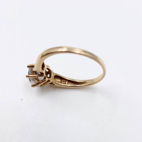 45 - Star Lot : A gem set claw mounted 10 carat Solitaire gold ring. Ring size - O. Weight - 2.42 grams.